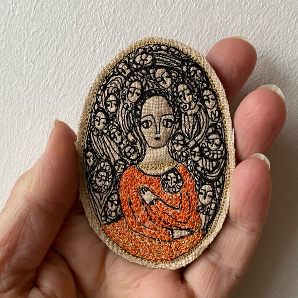 Image of Embroidery portrait brooch - woman in orange