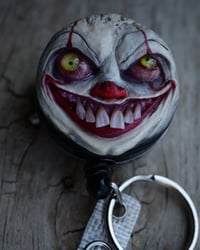 Image 1 of Handmade Pennywise Badge Reel Keychain 