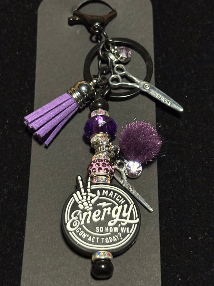 Image of hairstylist inspired black and purple purse clip keychain 