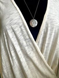 Image 4 of blue sapphire pendant with Fitzgerald quote