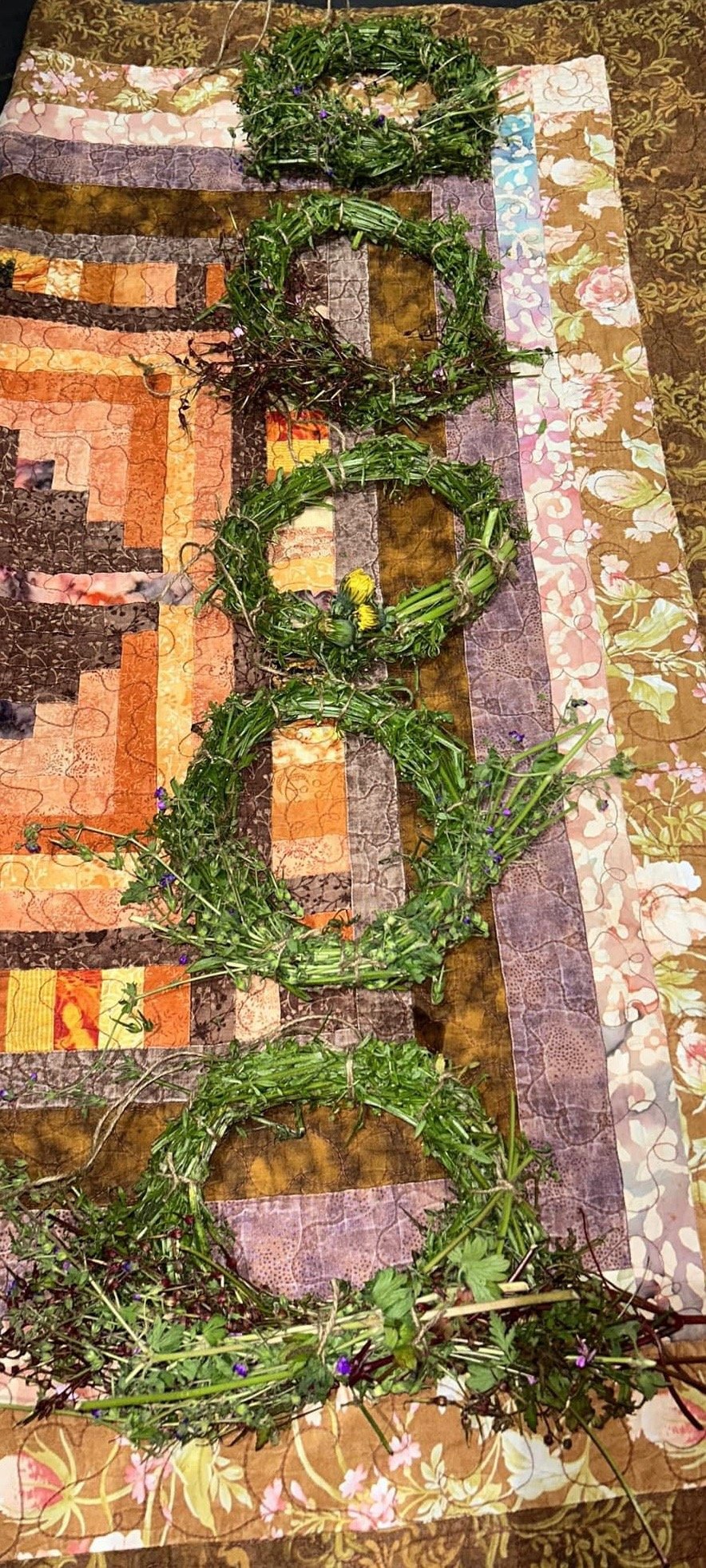 Image of goose grass wreaths with wild flowers