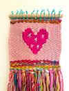 Candy yarn & a hot pink heart. Woven wall hanging.
