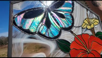 Image of Stained glass butterfly and hibiscus flowers