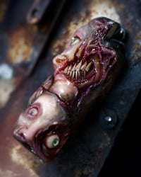 Image 2 of Face Off - collectible Clipper Lighter Sleeve