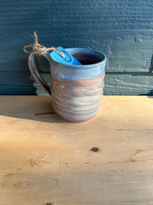 Image of M46 Blue lip over pink glazed mug, medium wider.