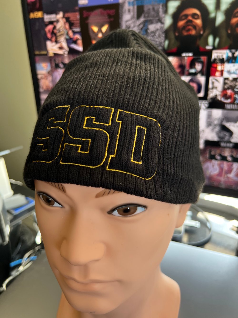 Black New Era Knit beanie hat with Gold Outline SSD logo 