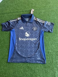 Image 1 of     Manchester United Navy Away Jersey 2024/25 – Snapdragon Edition