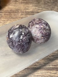 Purple mica tumbles 