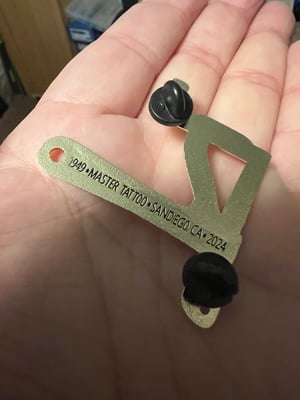 Image of 2” Brass 75th Anniv. Tahiti Felix Jonesy Pin