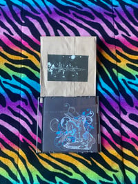 Image 1 of Her skin on porcelain paper bag cds 