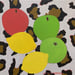 Image of Apples and Lemons on Leopard Print 