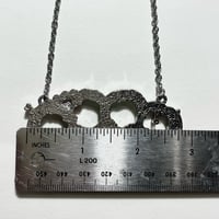 Image 3 of white zombie brass knuckle necklace 