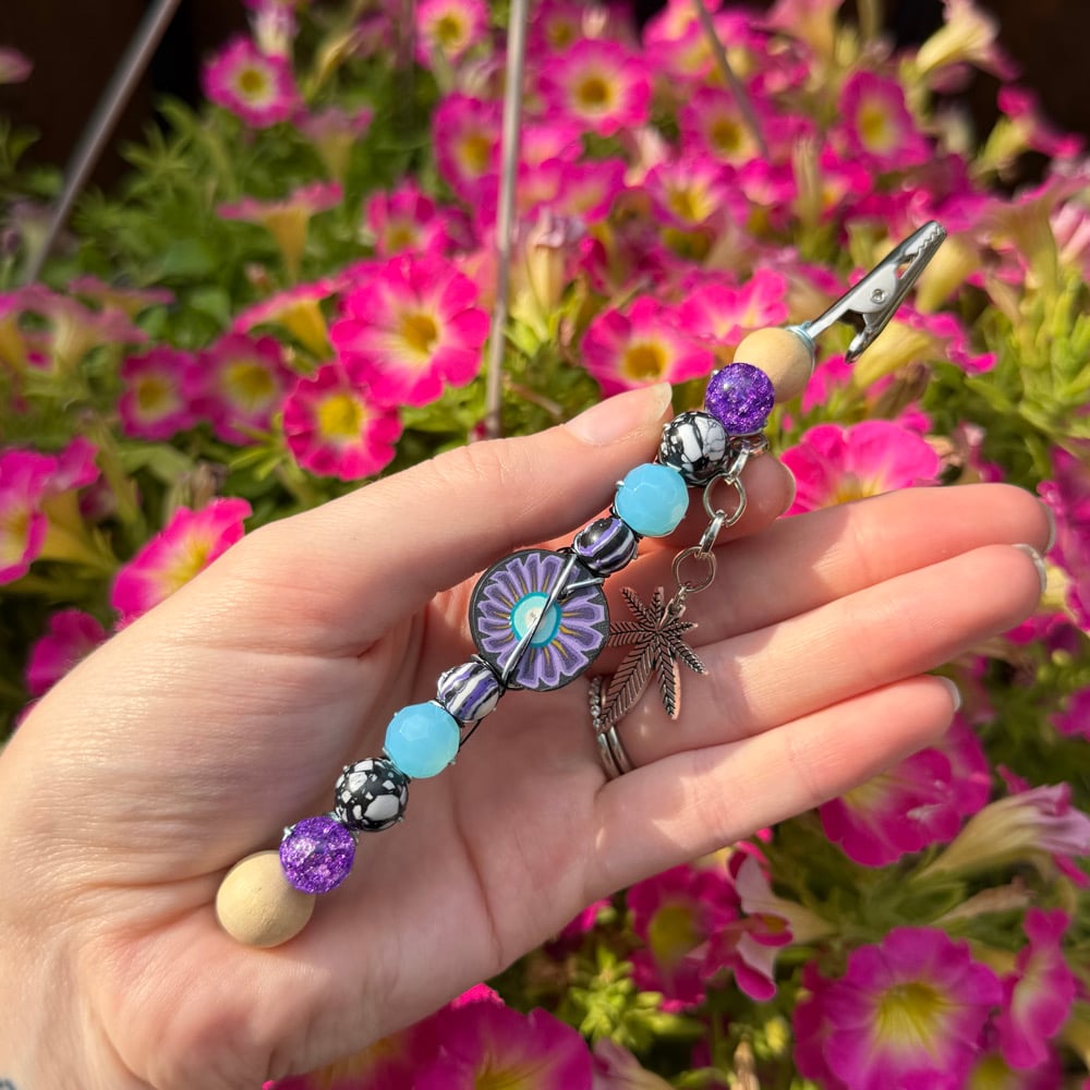 Image of twilight flower roach clip 
