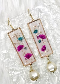 Image 1 of WHITE SPARKLY FLORAL DANGLES