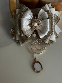 Image 3 of Starlight Shimmer Cream and Gold Sun, Moon, and Star Tumbler Straw Topper Bow
