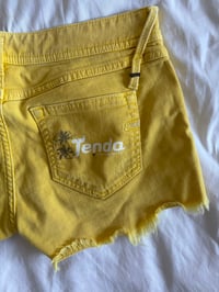 Image 3 of Vintage Y2K low rise yellow shorts with graphic and stud details