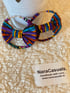 The RiNa Bowtie Loop Earrings Image 4