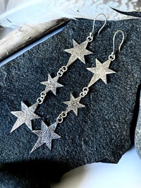 Image 3 of Handmade Silver Cosmic Triple Star Dangly Earrings. Celestial Silver Starry Earrings