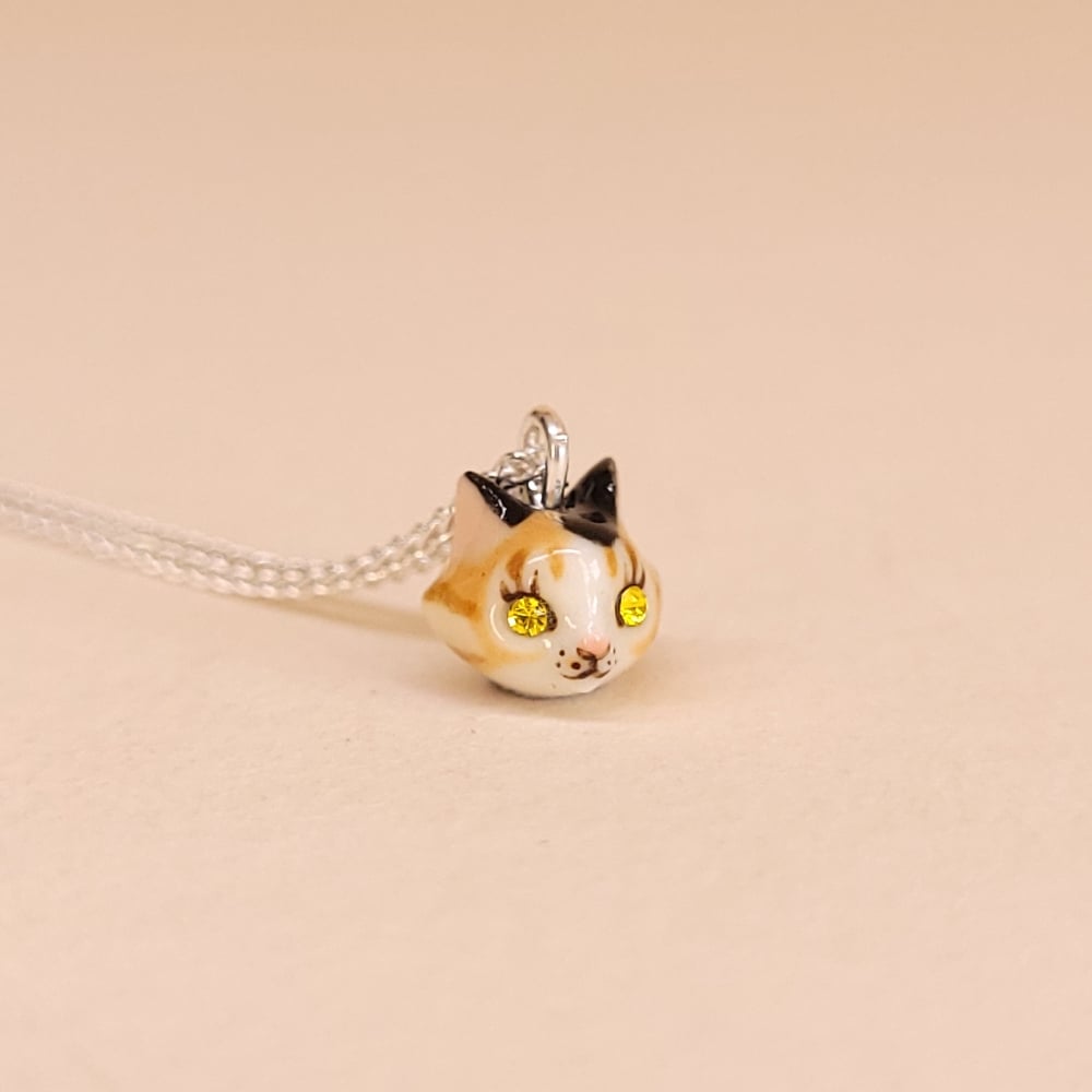 Image of Calico Porcelain & Sterling Silver Teeny Tiny Cat Pendant