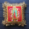 Leopard print fabric and red virgin of Guadalupe cushion cover with gold fringe