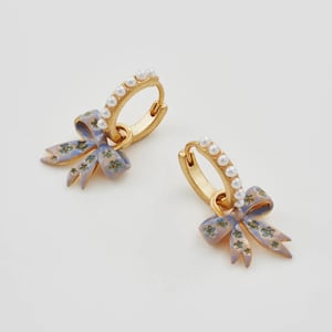 Image of Fable Pearl Bow Huggie Earrings