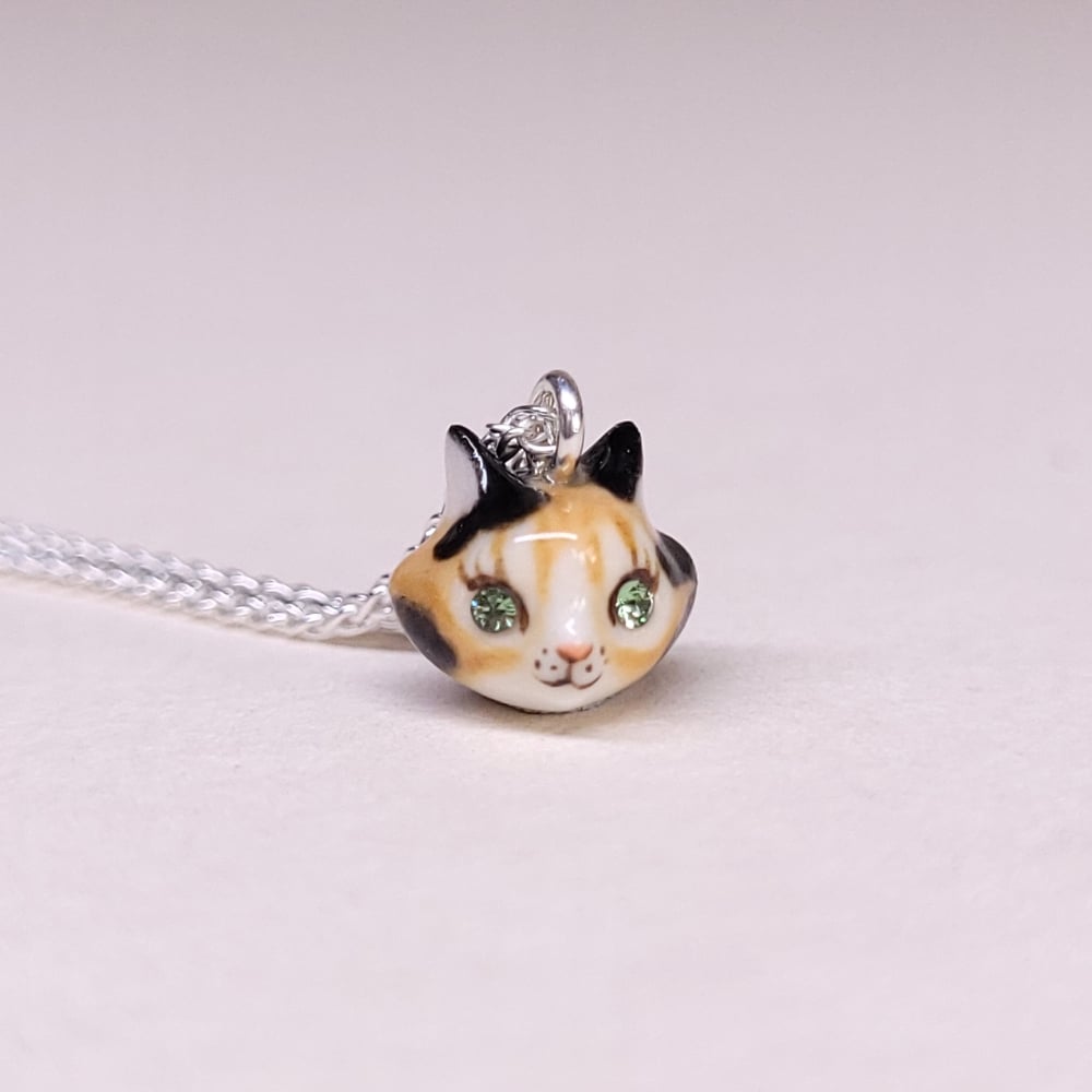 Image of Calico Porcelain & Gold Vermeil Teeny Tiny Cat Pendant