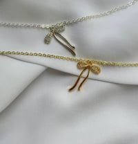 The bow necklace 