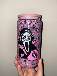 Image 1 of pink ghost face glass snowglobe 