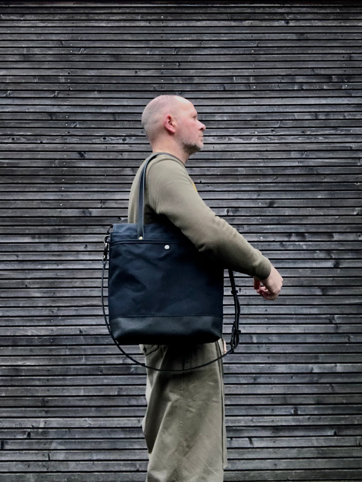 Black waxed canvas tote bag with leather bottom handles and cross body strap Treesizeverse