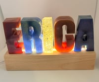Image 1 of Name with Stand