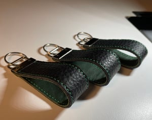 Image of Black and green key chain 