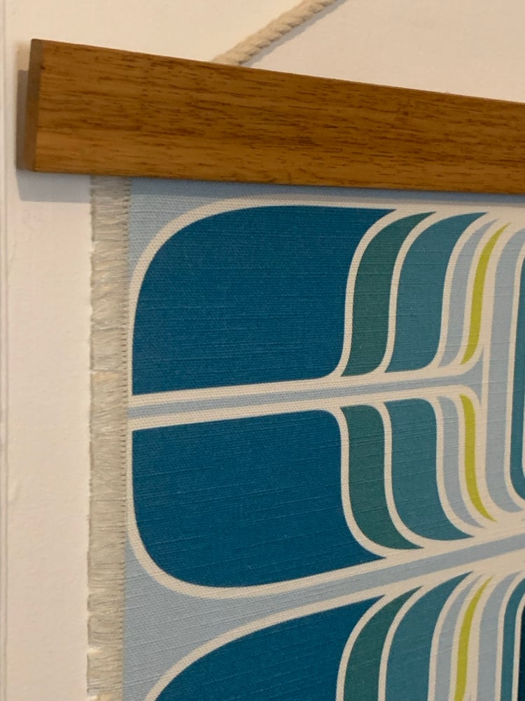 Image of ‘Teleport’ in teal Vintage Groove cotton wall hanging