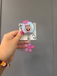 Sandy with flower charm 