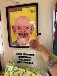 picture of me giving a thumbs up in front of a poster I like 