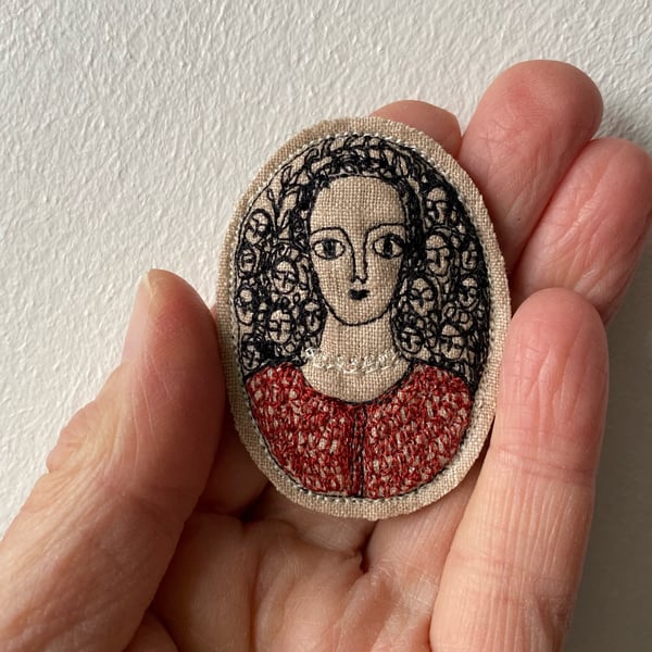 Image of Portrait of a woman in deep red - smaller than embroidery brooch 