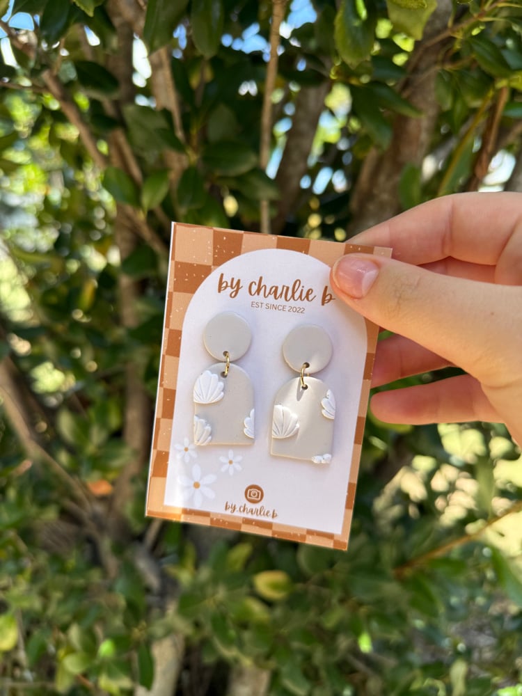 Image of Beige shell deco search dangles 