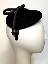 Image 1 of Black felt button w silk rouleau bow 