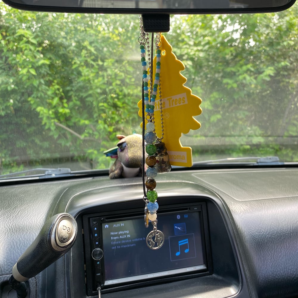 Image of peaceful earth car beads