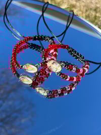 Red & White Dios Bracelets 
