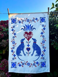 Image 1 of Hounds, hearts and flowers tea towel in blues and crimson 