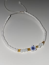 Image 2 of White/ Blue flower Evil eye bracelet 