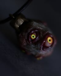 Image 8 of Egg of the King pendant, leather cord, brass hardware, all seeing glowing eyes