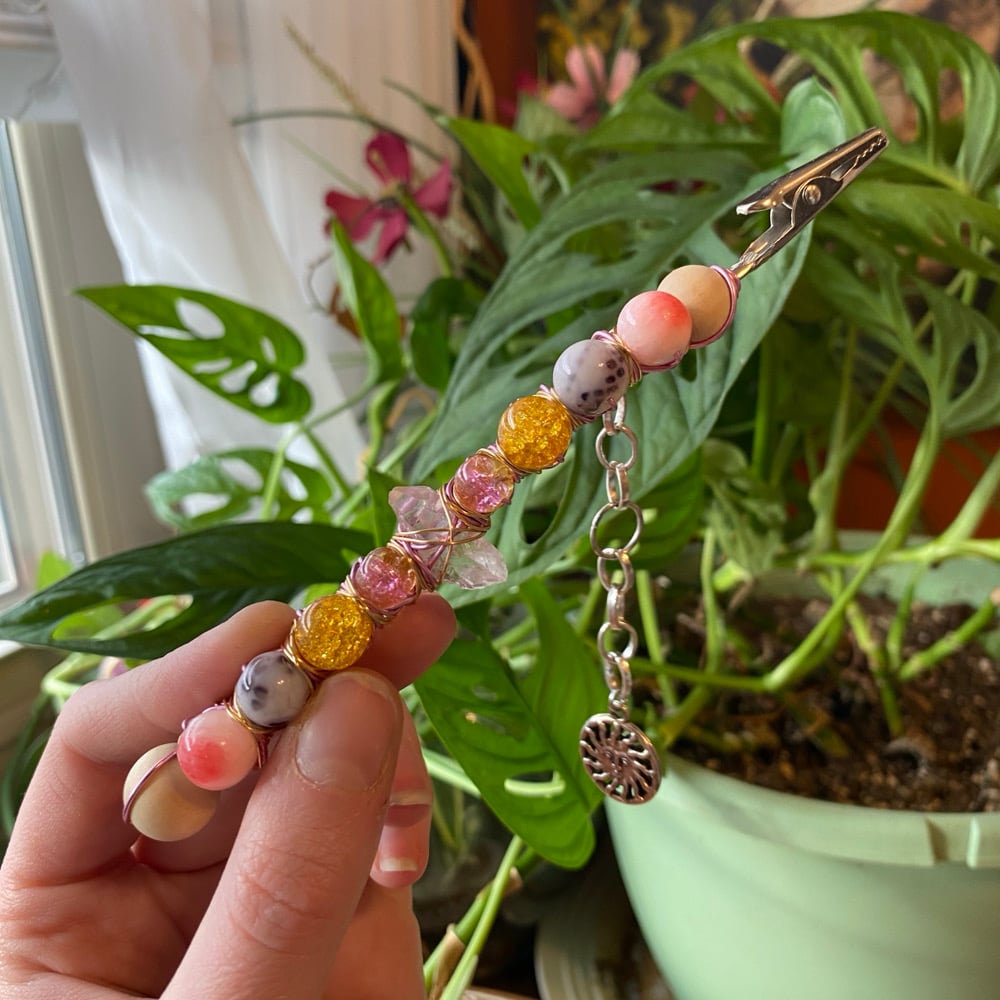 Image of strawberry sunset roach clip 