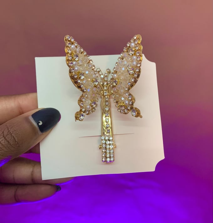 Image of Iced out moving butterfly clip