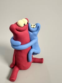 Image 2 of Blue thing hugging a red thing