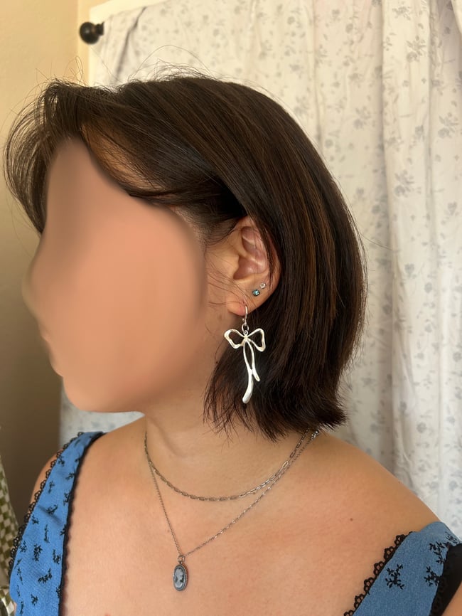 big melting silver bow earrings 