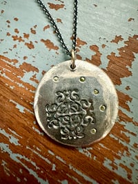 Image 1 of green sapphire pendant with handwritten quote