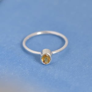 Image of Sri Lanka Honey Yellow Sapphire oval cut classic silver ring