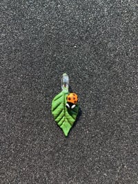 Image 1 of Small Green Leaf W/ Orange Bug Eyed Ladybug pendant 