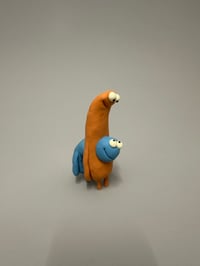 Image 1 of A blue thing peeking out of a brown thing 2